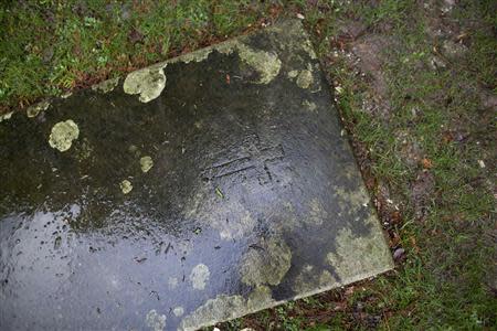 A headstone is seen the grounds of St Bartholmew's Church in Winchester January 17, 2014. REUTERS/Kieran Doherty