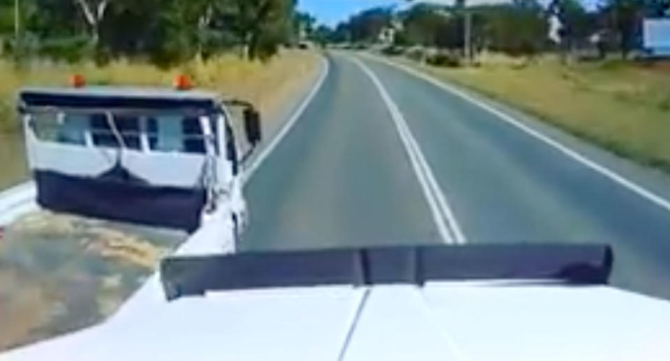 Small truck shown undertaking big truck nearly causing a serious accident.