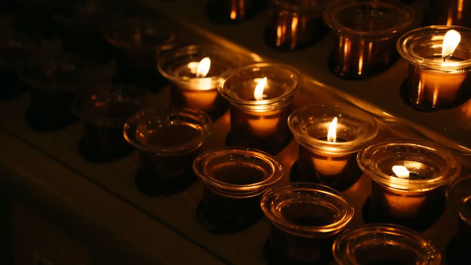 Mourners light candles inside St. Patrick's Cathedral before Gentili's funeral. - Laura Oliverio/CNN