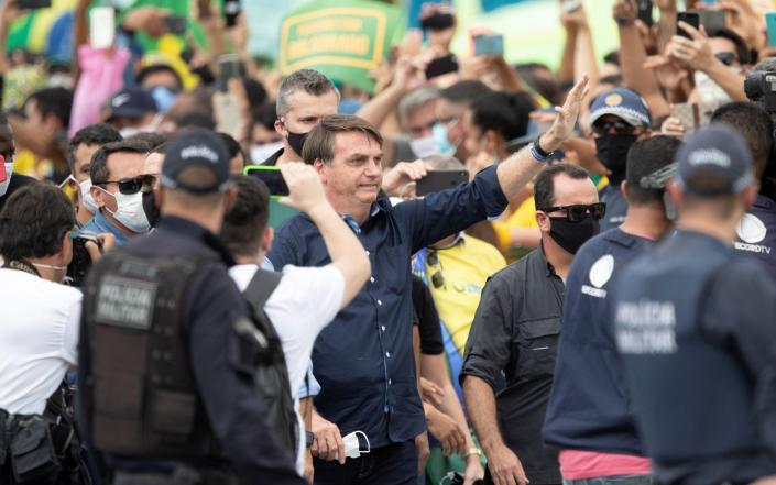 Brazilian president Jair Bolsonaro meets supporters during a demonstration, in Brasilia, Brazil - o&#xc3;&#xa9;dson Alves/EPA-EFE/Shutterstock
