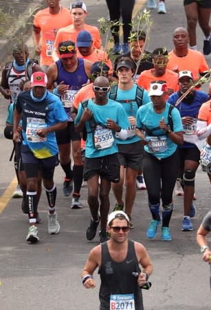 Part of a group of 20 runners approach the final stretch of the Cape Town marathon