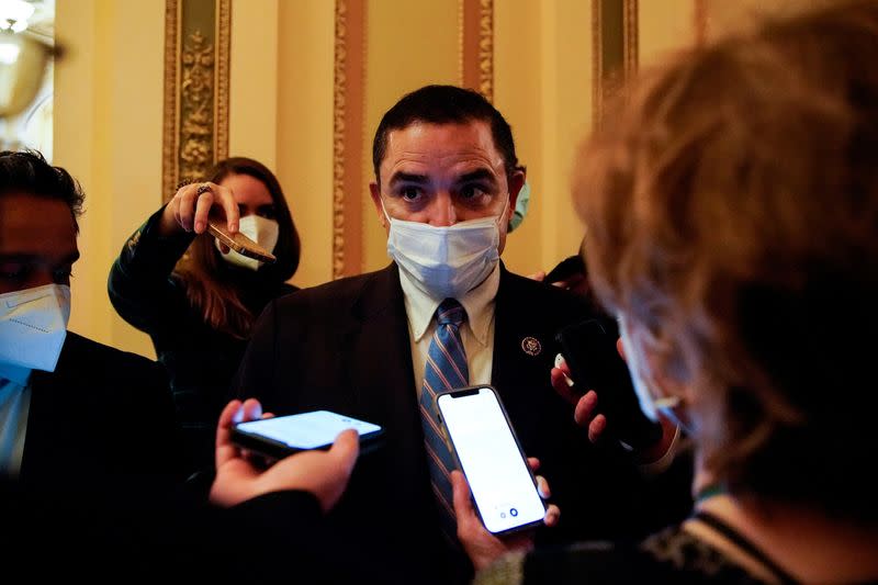 FILE PHOTO: U.S. Representative Henry Cuellar (D-TX) stops to talk to reporters on his way vote on the House floor at the U.S. Capitol in Washington