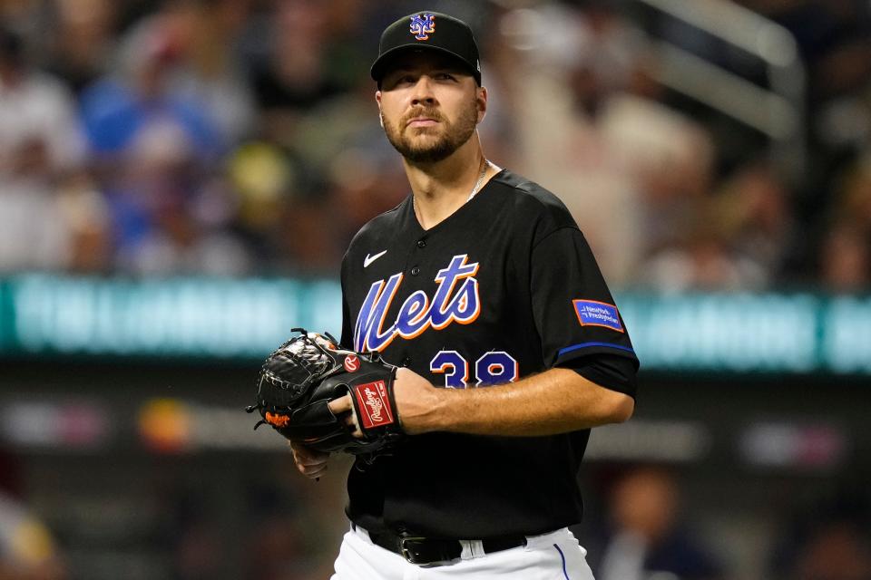 New York Mets starting pitcher Tylor Megill reacts as he leaves during the sixth inning of a baseball game against the Atlanta Braves Friday, Aug. 11, 2023, in New York.