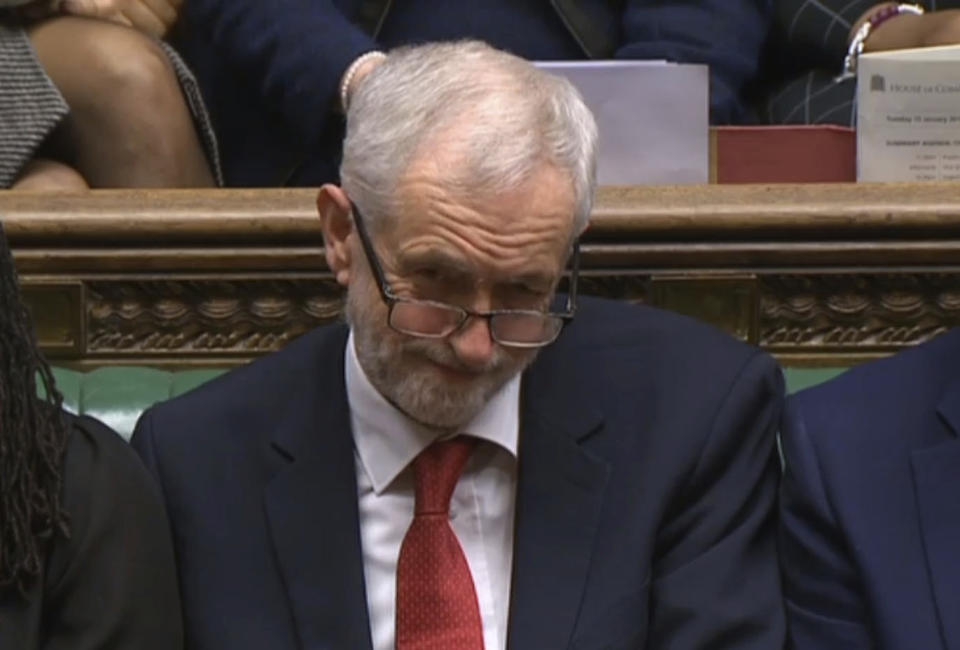 In this grab taken from video, Labour leader Jeremy Corbyn listens to the conclusion of the debate ahead of a vote on the Britan's Prime Minister, Theresa May's Brexit deal, in the House of Commons, London, Tuesday Jan. 15, 2019. British lawmakers have begun voting on whether to approve or reject the divorce agreement between the government and the European Union. (House of Commons/PA via AP)