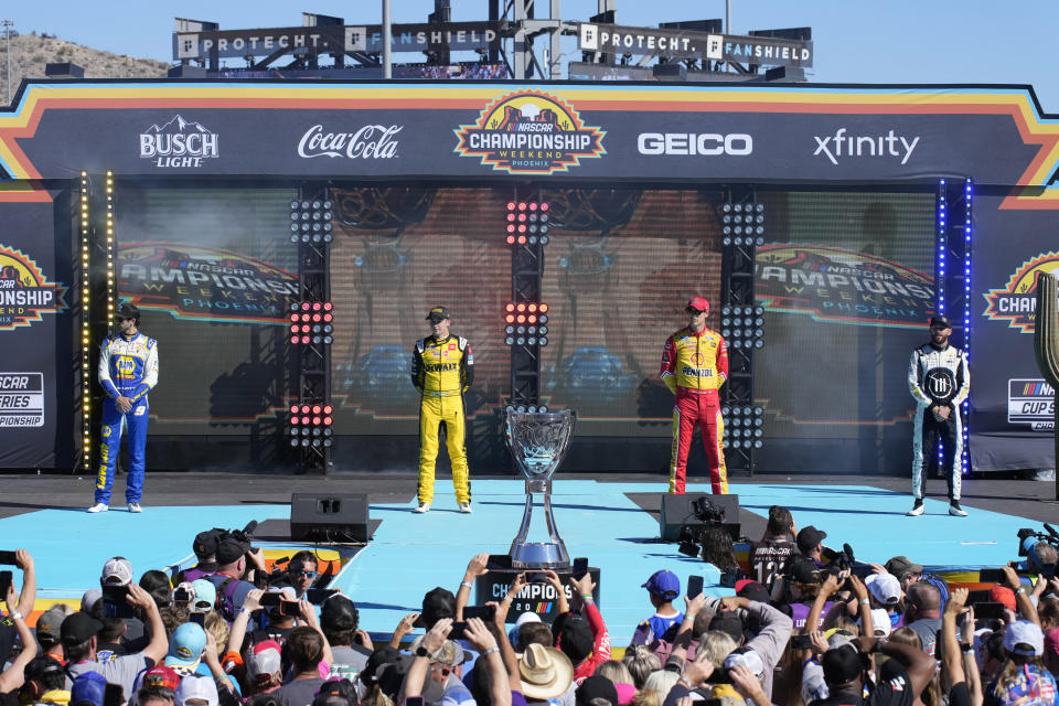 From left to right, Ross Chastain, Christopher Bell, Joey Logano and Chase Elliott are introduced to the fans before a NASCAR Cup Series auto race Sunday, Nov. 6, 2022, in Avondale, Ariz. (AP Photo/Rick Scuteri)