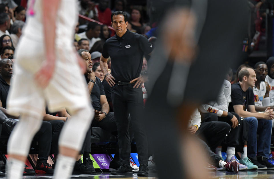 Miami Heat coach Erik Spoelstra watches his team take on the Brooklyn Nets during the first half of an NBA basketball game, Saturday, March 25, 2023, in Miami, Fla. (AP Photo/Michael Laughlin)
