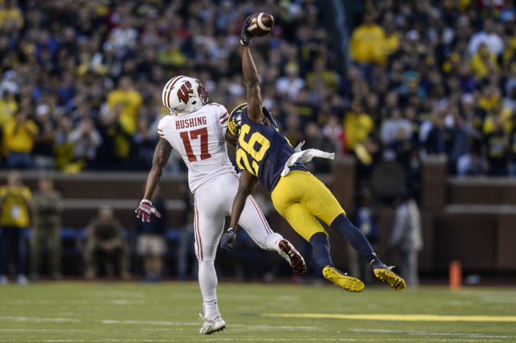 Michigan's Jourdan Lewis stretches for the game-winning interception on Saturday. (AP)