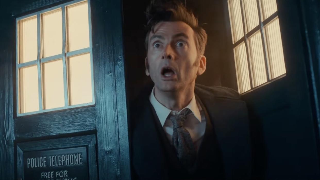  David Tennant as the Fourteenth Doctor standing in the TARDIS' entrance looking shocked. 