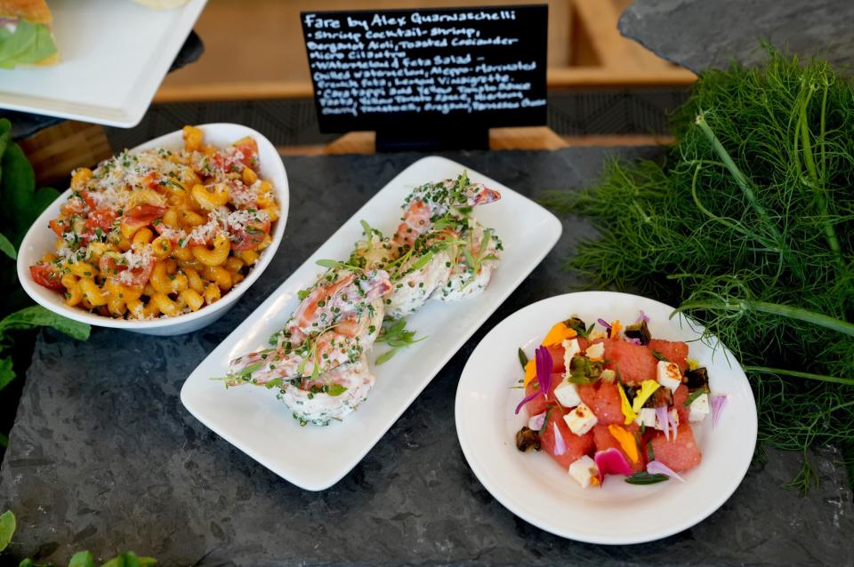 A general view of the Cavatappi and Yellow Tomato Sauce Pasta, Shrimp Cocktail, and Watermelon and Feta Salad by Fare by Alex Guarnaschelli during the Food Tasting Preview at the 2021 US Open, Thursday, Aug. 26, 2021 in Flushing, NY