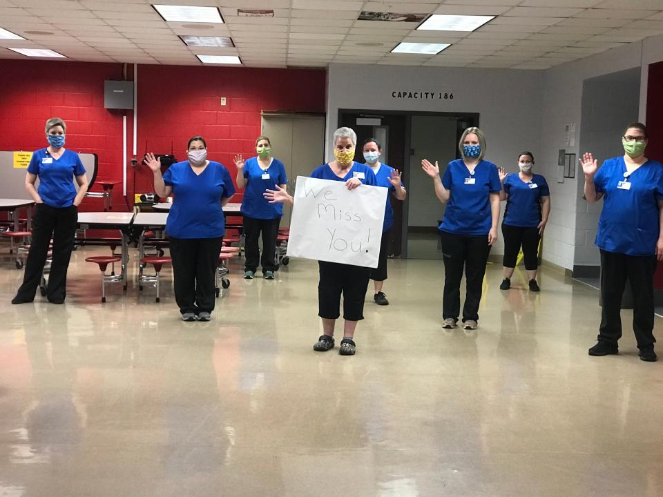Cafeteria workers with the Warrick County School Corp. in southern Indiana pose for a photo greeting sent to students. Food service coordinators there estimate their meal program has lost $500,000 since March due to decreased revenue and increased expenses related to COVID-19.