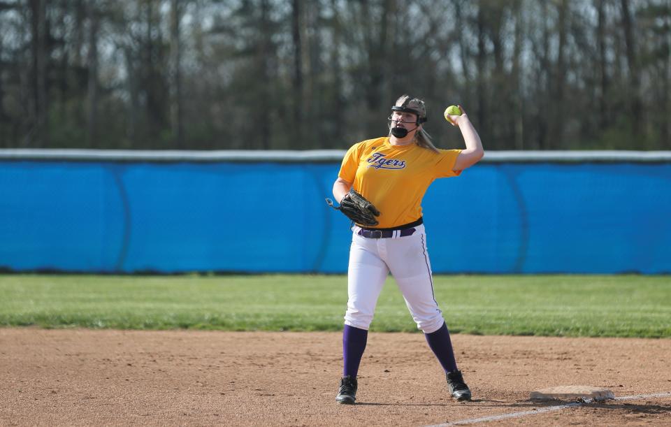 Hagerstown senior Marissa Slagle throws the ball to home plate before a Wayne County Tournament game April 23, 2022.