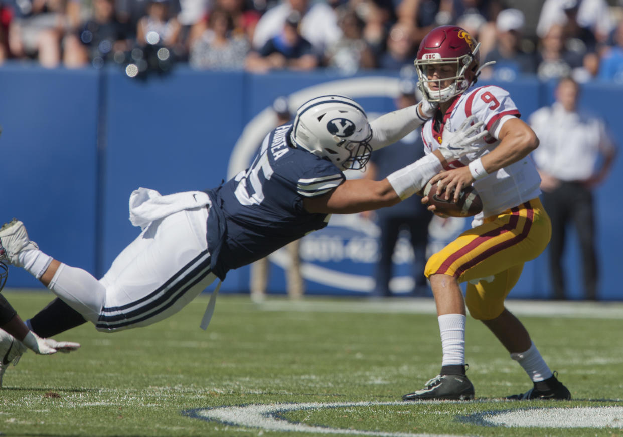 PROVO, UT - SEPTEMBER 14: Lorenzo Fauatea #55 of the BYU Cougars pressures Kedon Slovis #9 of the USC Trojans during their game at LaVell Edwards Stadium on September 14, 2019 in Provo, Utah. (Photo by Chris Gardner/Getty Images)