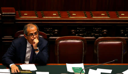 FILE PHOTO: Italian Economy Minister Giovanni Tria attends as Prime Minister Giuseppe Conte (unseen) speaks during his first session at the Lower House of the Parliament in Rome, Italy, June 6, 2018. REUTERS/Tony Gentile/File Photo