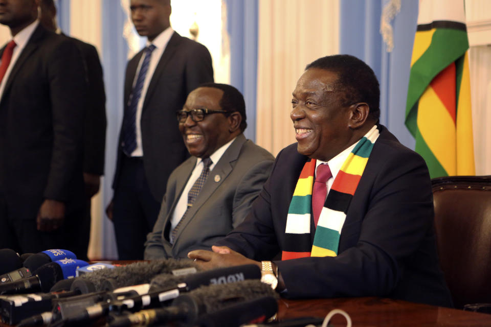 Zimbabwean President elect Emmerson Mnangagwa smiles while addressing a press conference in Harare ,Friday, Aug, 3, 2018. Zimbabwe's president says people are free to approach the courts if they have issues with the results of Monday's election, which he carried with just over 50 percent of the vote. President Emmerson Mnangagwa spoke to journalists shortly after opposition leader Nelson Chamisa called the election results manipulated and said they would be challenged in court. (AP Photo/Tsvangirayi Mukwazhi)