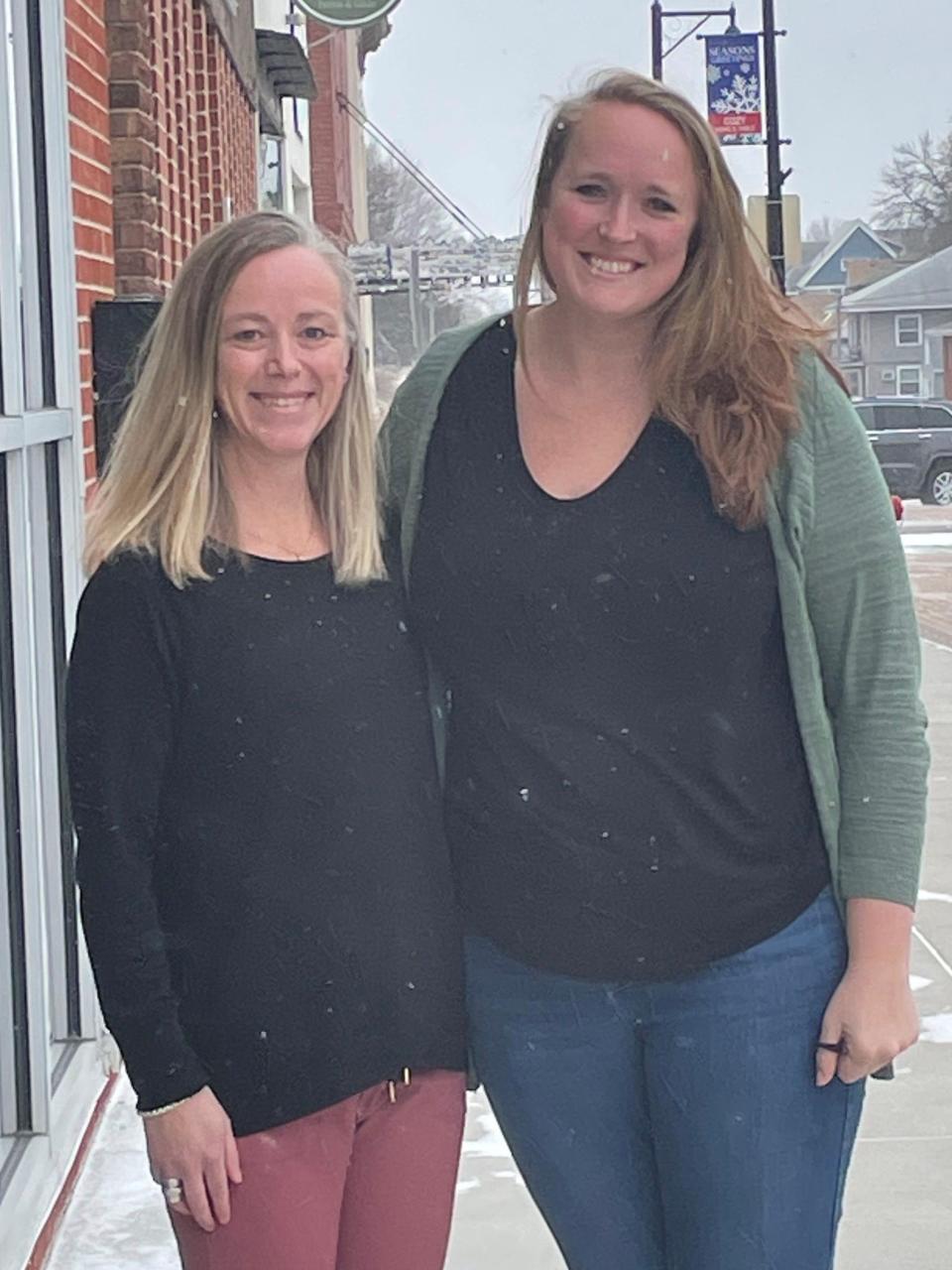 Nevada farmers market coordinator Bre Taege, right, poses with Main Street Nevada Director Emily Schaack on Sixth Street Feb. 16, 2023.