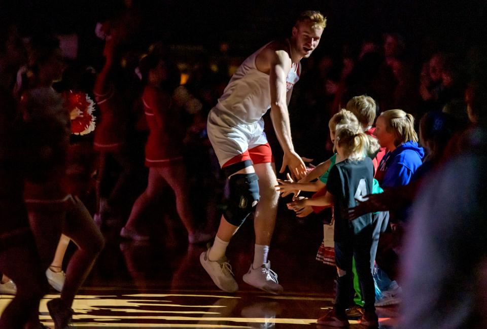 Bradley's Rienk Mast greets some young fans during player introductions before the start of their game against Valparaiso on Saturday, Jan. 7, 2023 at Carver Arena. The Braves defeated the Beacons 88-66.