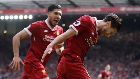 Britain Football Soccer - Liverpool v Middlesbrough - Premier League - Anfield - 21/5/17 Liverpool's Adam Lallana celebrates scoring their third goal with Emre Can Action Images via Reuters / Carl Recine Livepic