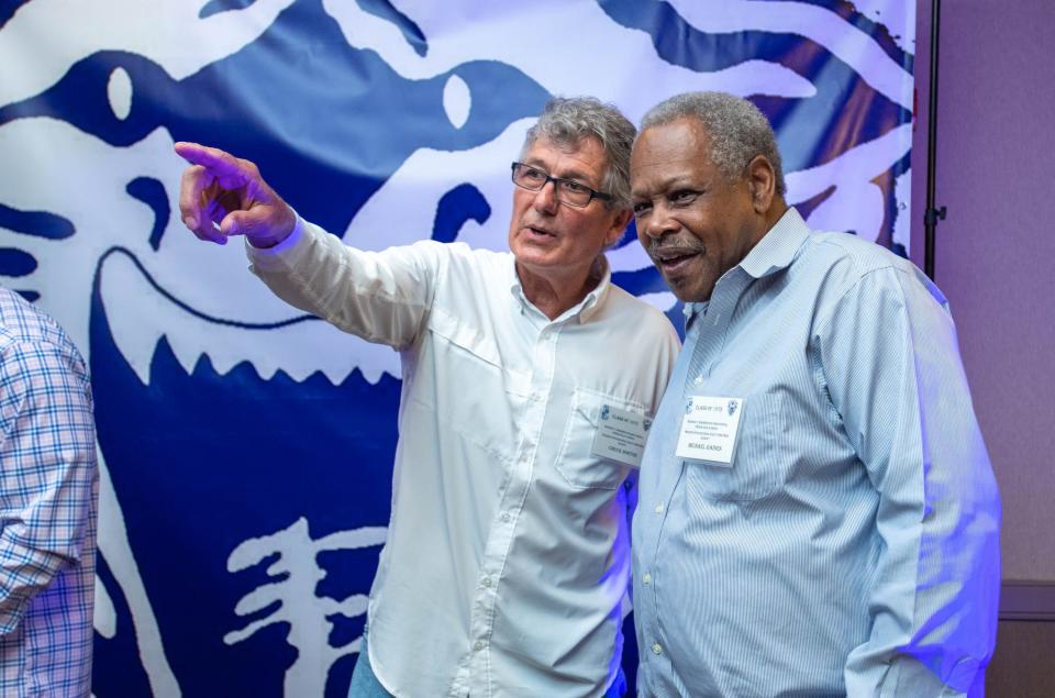 Former Wildcats football teammates Chuck Norton, left, and Michael Gaines chat during Booker T. Washington High School class of 1973’s 50th reunion at the Hilton Garden Inn in Pensacola on Friday, May 5, 2023.  The Class of ’73 was the first to enter and graduate from the then newly desegregated school.
