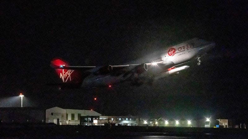A repurposed Virgin Atlantic Boeing 747 aircraft, named Cosmic Girl, carrying Virgin Orbit's LauncherOne rocket, takes off from Spaceport Cornwall at Cornwall Airport, Newquay. 