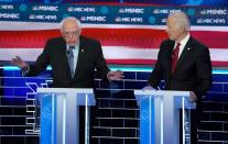 Senator Bernie Sanders speeks as former Vice President Joe Biden listens at the ninth Democratic 2020 U.S. Presidential candidates debate at the Paris Theater in Las Vegas