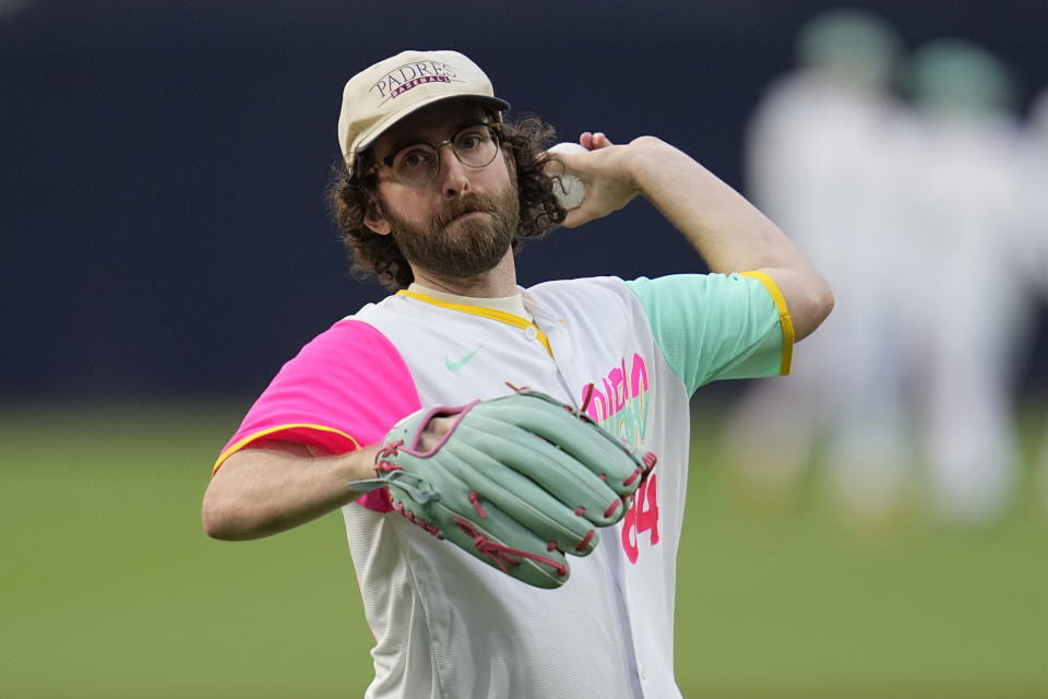 Actor and writer Kyle Mooney throws out a ceremonial first pitch before the San Diego Padres play the San Francisco Giants in a baseball game Friday, Sept. 1, 2023, in San Diego. (AP Photo/Gregory Bull)