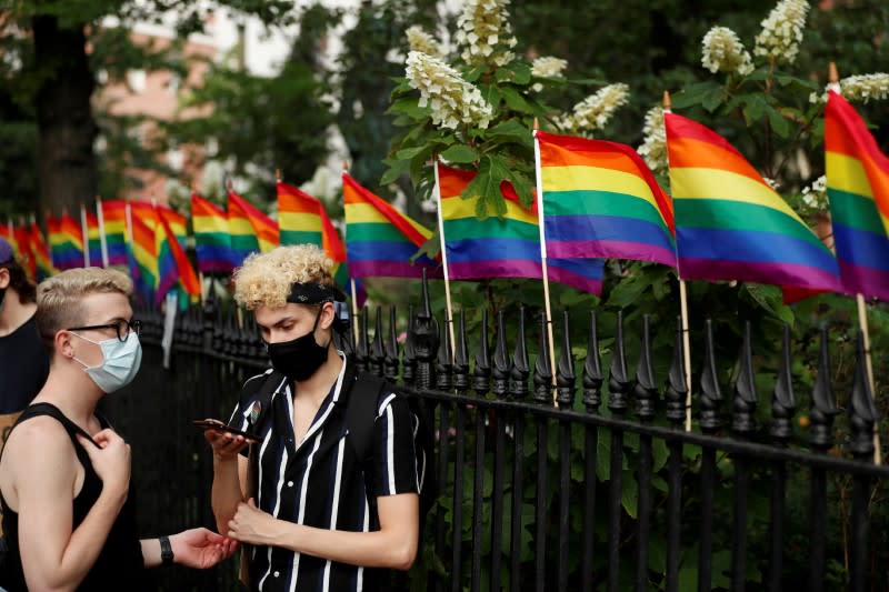 FILE PHOTO: Demonstrators take a moment while listening to speakers voice their support for gay pride and black lives matter movements in New York City