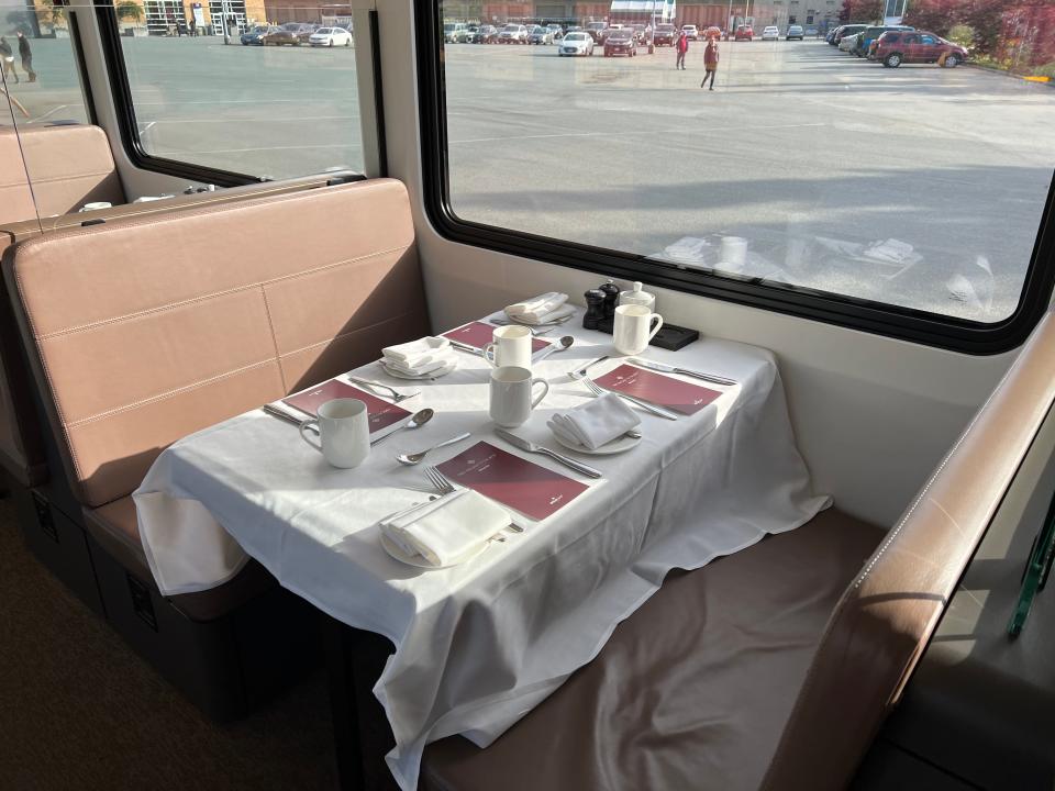 Dining table, set with utensils and menus, in dining car