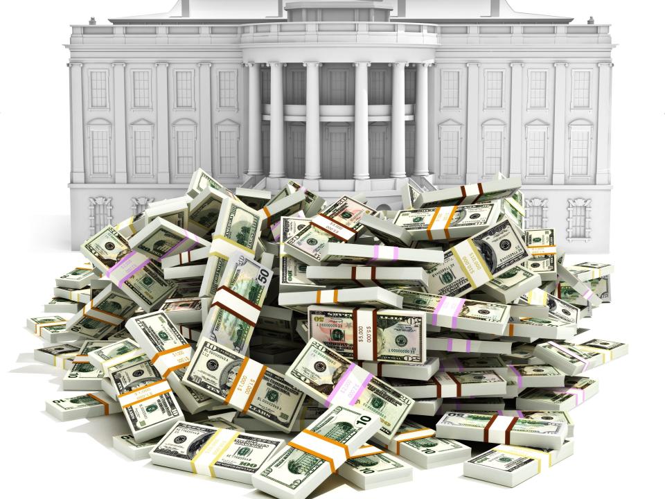 White House illustration with pile of money in front of it