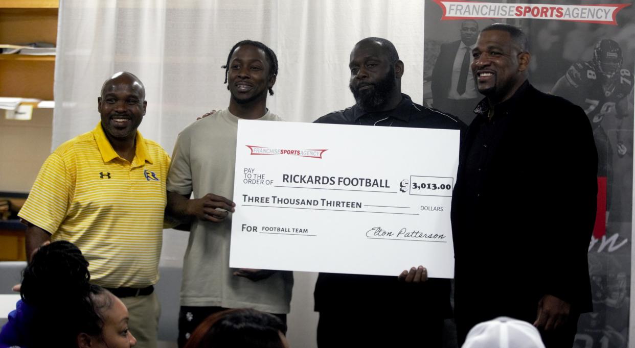 Rickards high school athletes sign to college, FAMU's Marcus Riley signs with agent Elton Patterson ahead of NFL draft at Rickards High School on Wednesday April 24, 2024