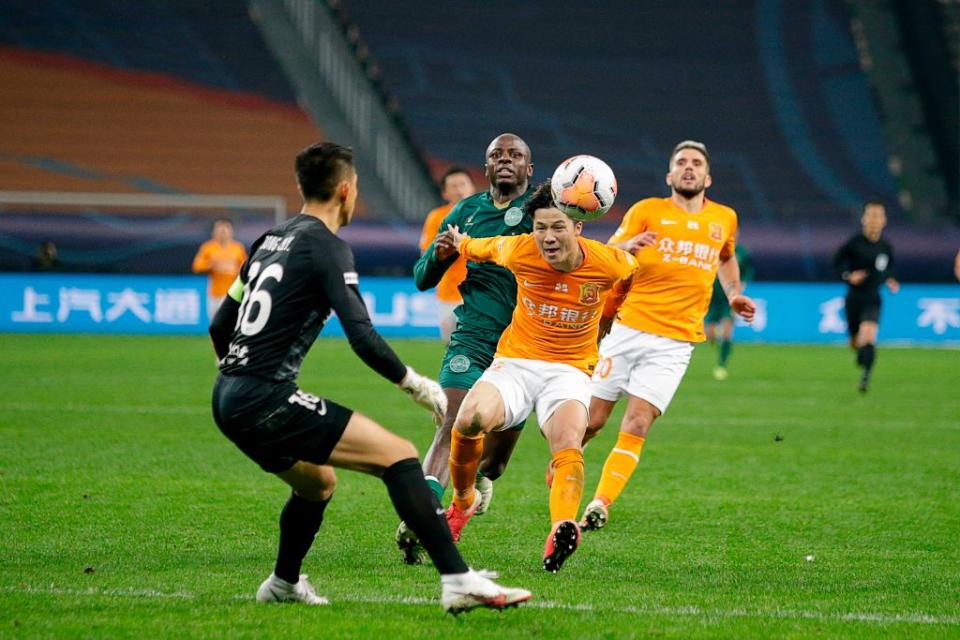 Wuhan Zall's Ming Tian kicks the ball during the Chinese Super League football (CSL) promotion/relegation play-off qualification match between Wuhan Zall and Zhejiang Greentown in Suzhou in China's eastern Jiangsu province on November 22, 2020.<span class="copyright">STR/AFP via Getty Images</span>