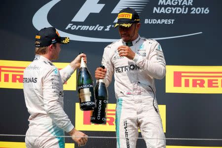 Hungary Formula One - F1 - Hungarian Grand Prix 2016 - Hungaroring, Hungary - 24/7/16 Mercedes' Lewis Hamilton and Nico Rosberg celebrate after the race REUTERS/Laszlo Balogh