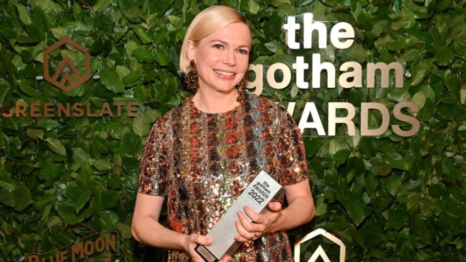 Michelle Williams poses with an award in the GreenSlate Greenroom at The 2022 Gotham Awards at Cipriani Wall Street.