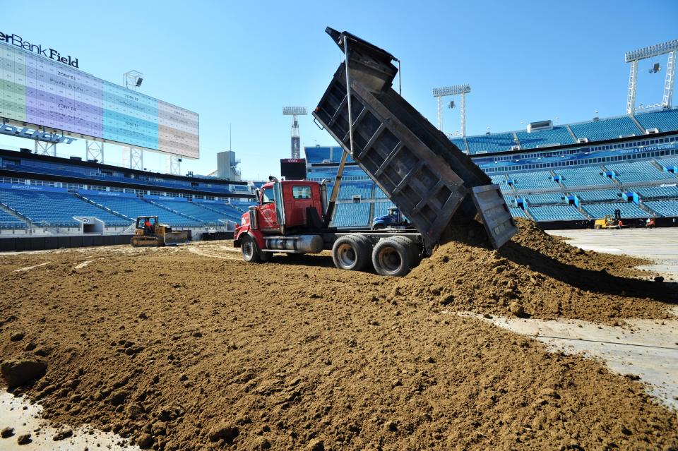 Literally, tons of dirt are trucked in and dumped into the field at TIAA Bank Field. For the event in 2016, more than 300 loads of dirt were used.