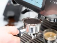To make an espresso, add the ground coffee to the portafilter and tightly press them down until the coffee is even and flat.