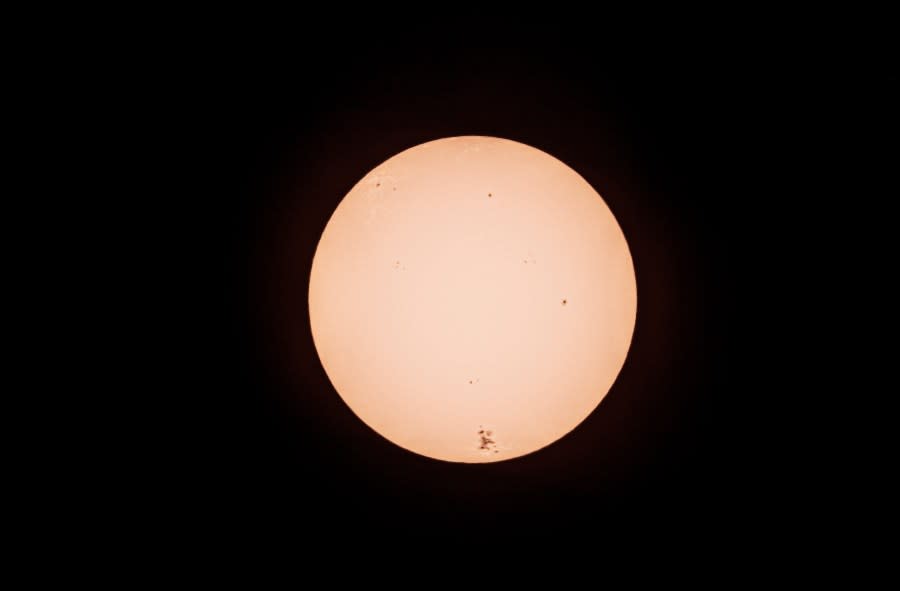 A photo of the sun using a white light solar filter, which captures the visible photosphere, shows the large area of sun spots and surface activity as seen from Oakland, Calif., Saturday, May 11, 2024. The sun has produced strong solar flares since Wednesday, resulting in at least seven outbursts of plasma. NOAA predicted that the flares will continue through at least Sunday. Brilliant purple, green, yellow and pink hues of the Northern Lights were reported worldwide. (Carlos Avila Gonzalez/San Francisco Chronicle via AP)