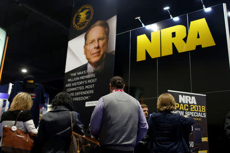 People sign up at the booth for the National Rifle Association (NRA) at the Conservative Political Action Conference (CPAC) at National Harbor, Maryland, U.S., February 23, 2018. REUTERS/Joshua Roberts