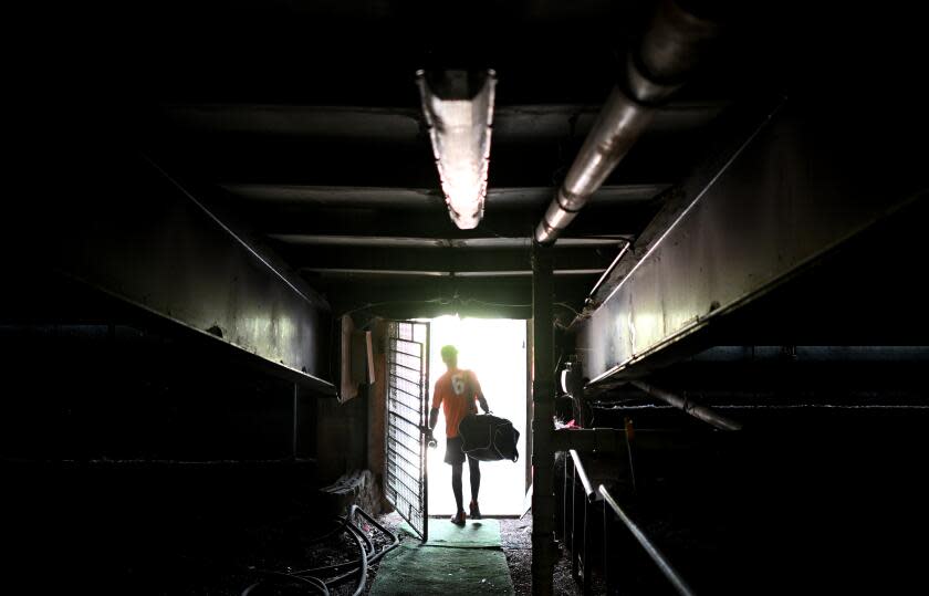 Trenton, New Jersey June 2, 2023-Frederick Keys player Dennis Kasumba walks through a tunnel leading to the Trenton Thunder field in Trenton, New Jersey. Famous Yankee players Derek Jeter, Aaron Judge, Andy Pettite and Alex Rodriguez walked through the same tunnel while in the minor leagues. (Wally Skalij/Los Angeles Times)