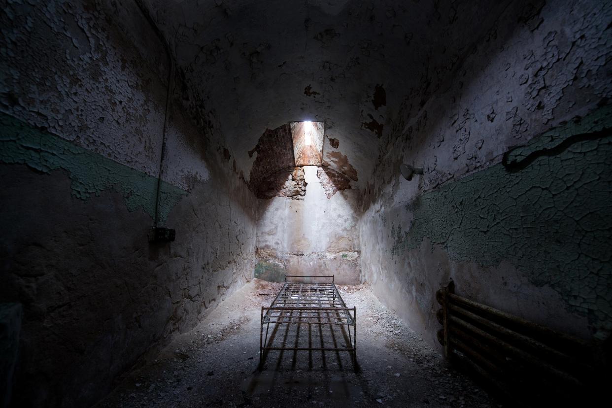 bed frame in an abandoned cell