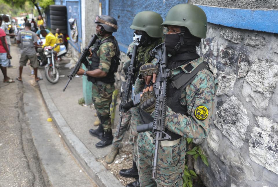 Police stand guard outside the office of the prime minister in preparation for the swearing-in of a transitional council tasked with selecting a new prime minister and cabinet, in Port-au-Prince, Haiti, Thursday, April 25, 2024. (AP Photo/Odelyn Joseph)