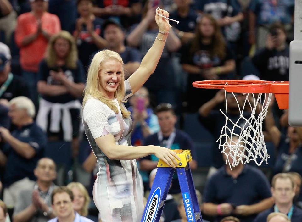 Connecticut assistant coach Shea Ralph cuts down the net after winning the 2015 championship game against Notre Dame.