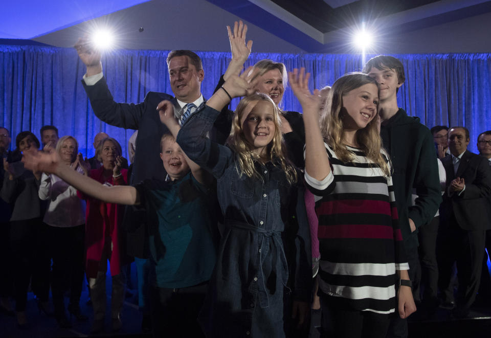 FILE - In this Oct. 15, 2019, file photo, Conservative leader Andrew Scheer, his wife Jill and their children Henry, from left, Maddie, Grace and Thomas stand onstage following a campaign speech in La Prairie, Quebec. Polls show that Scheer has a chance to defeat Justin Trudeau's Liberal party in national elections on Monday, Oct. 21. (Adrian Wyld/The Canadian Press via AP)