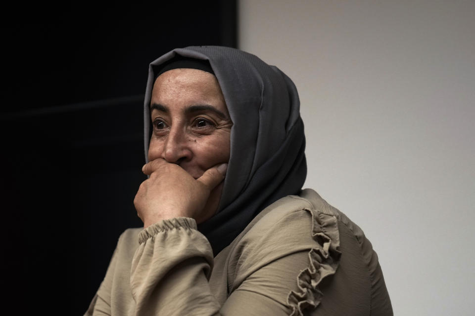 Cigdem Kuzey, sister of Muhterem Evcil, looks on during an interview with the Associated Press in Istanbul, Turkey, Wednesday, March 6, 2024. Muhterem Evcil was stabbed to death by her estranged husband at her workplace in Istanbul, where he had repeatedly harassed her in breach of a restraining order. More than a decade later, her sister believes Evcil would still be alive if authorities had enforced laws on protecting women and jailed him. (AP Photo/Khalil Hamra)