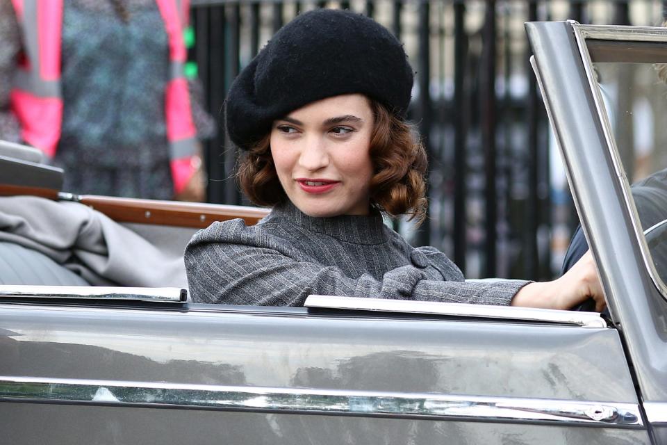 <p>Lily James is seen driving a vintage convertible in character while filming for the new BBC rom-com <i>The Pursuit of Love</i> in Bath, England. </p>