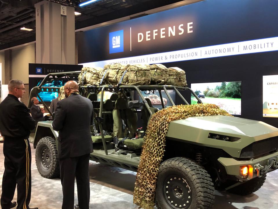 Vice Chief of Staff of the U.S. Army Joseph Martin (left) discusses the Infantry Squad Vehicle capabilities with David Albritton (right), president of GM Defense. They are at the 2019 annual Association of the U.S. Army (AUSA) conference in Washington, DC.