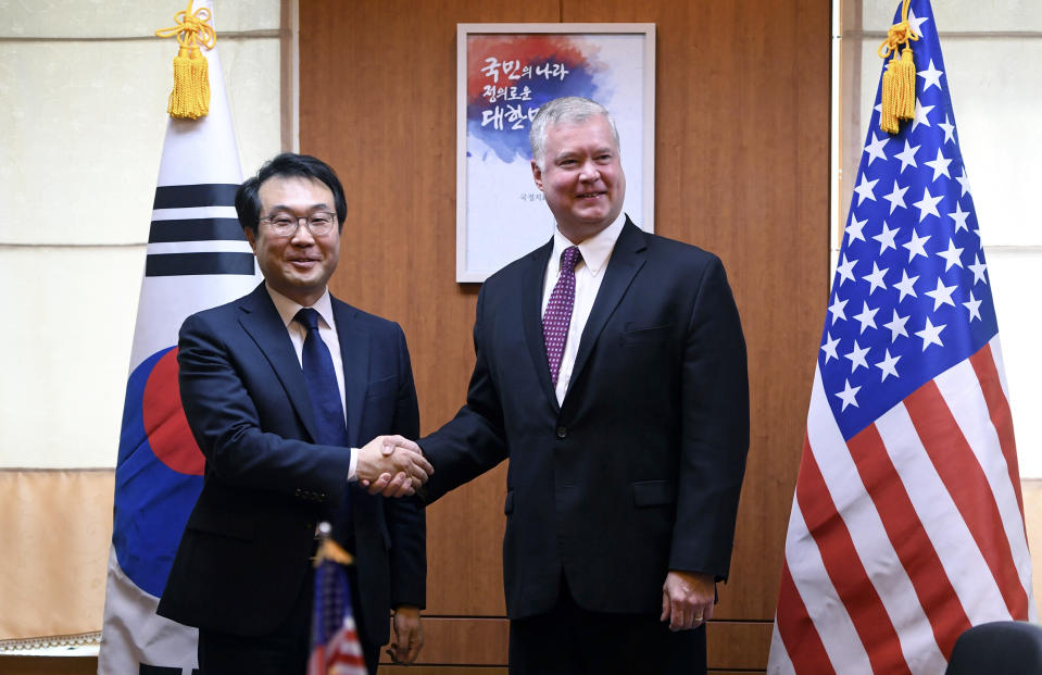 U.S. special envoy for North Korea Stephen Biegun, right, and South Korea's special representative for Korean Peninsula Peace and Security Affairs Lee Do-hoon, left, shake hands during their meeting at the Foreign Ministry in Seoul Tuesday, Sept. 11, 2018. (Jung Yeon-je/Pool Photo via AP)