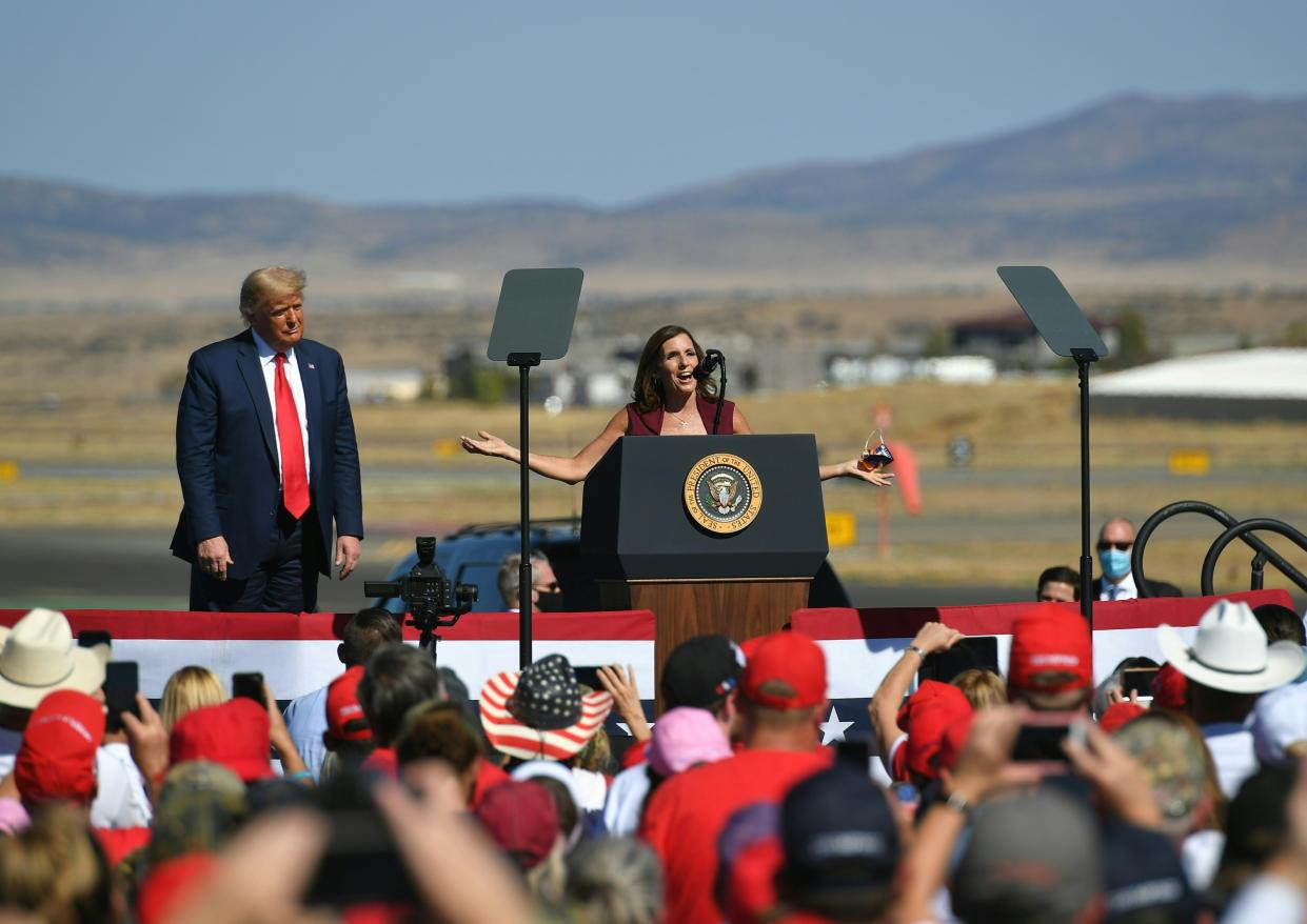 President Trump barnstormed through Arizona on Monday, here listening to Senator Martha McSally speak about her race in Prescott. (Photo by MANDEL NGAN/AFP via Getty Images)
