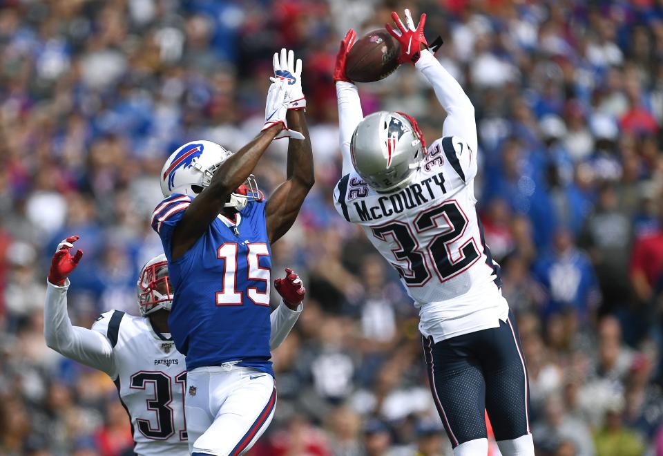 New England Patriots safety Devin McCourty (32) intercepted a pass intended for Buffalo Bills wide receiver John Brown (15) in the first half of an NFL football game, Sunday, Sept. 29, 2019, in Orchard Park, N.Y. (AP Photo/Adrian Kraus)