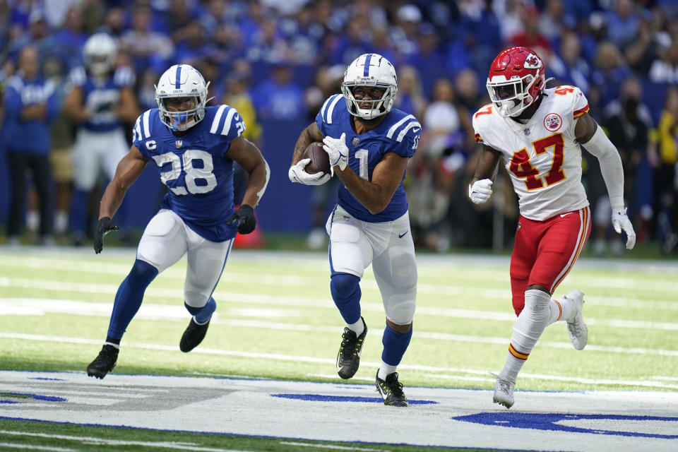 Indianapolis Colts' Michael Pittman Jr. (11) is tackled by Kansas City Chiefs' Darius Harris (47) during the second half of an NFL football game, Sunday, Sept. 25, 2022, in Indianapolis. (AP Photo/Michael Conroy)