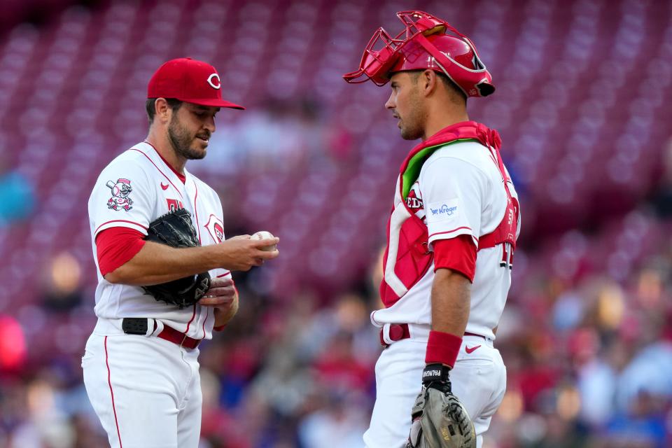 Cincinnati Reds catcher Luke Maile (22) vista Cincinnati Reds starting pitcher Connor Overton (71) in the first inning of a baseball game between the Chicago Cubs and the Cincinnati Reds, Monday, April 3, 2023, at Great American Ball Park in Cincinnati. 