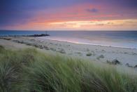 <p>Hengistbury Head is a headland (hence the name!) protruding into the English Channel between Bournemouth and Mudeford in the English countryside of Dorset. Look at that sunset!<br></p><p><a class="link " href="https://www.booking.com/index.en-gb.html?label=gen173nr-1BCAEoggI46AdIM1gEaFCIAQGYAQm4AQfIAQzYAQHoAQGIAgGoAgO4AoaD8PkFwAIB0gIkMjllNzUwZjMtNzJjNi00ZmQxLTlmZTYtNjljZDNkZGUzNGZm2AIF4AIB%3Bsid%3Dd557a040829a867b722f4b6cf8934591%3Bkeep_landing%3D1&sb_price_type=total" rel="nofollow noopener" target="_blank" data-ylk="slk:FIND ACCOMMODATION;elm:context_link;itc:0;sec:content-canvas">FIND ACCOMMODATION </a></p>